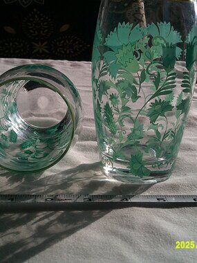 Set of 2 green floral design cups with a metallic gold rim